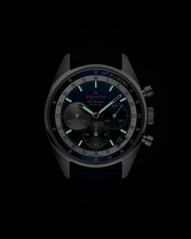 The Zenith Chronomaster Original features a dark dial, three subdials, and luminous hour markers and hands.