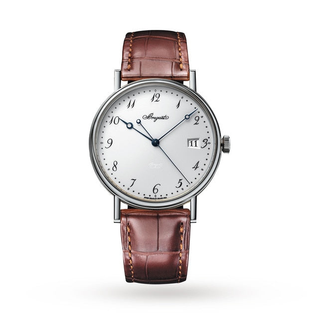The Breguet Classique 5177 features a white dial with blue hands, Arabic numerals, a date display, brown leather strap, and an elegant 18-carat white gold case.