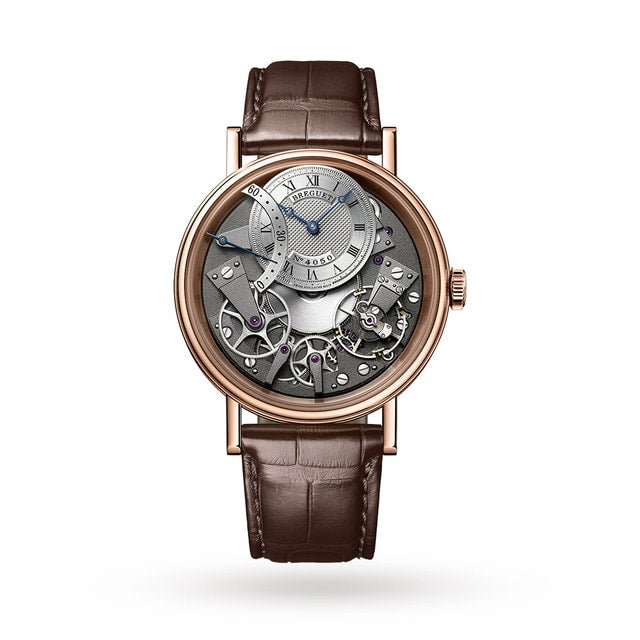 The Breguet Tradition Seconde Rétrograde 7097 is a luxury wristwatch with a brown leather strap, exposed mechanical movement, and a silver dial with Roman numerals—showcasing Swiss watchmaking artistry.