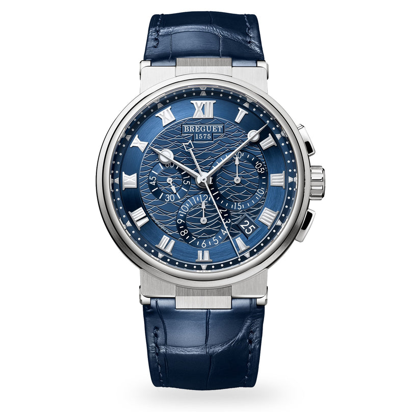 The Breguet Marine Chronographe 5527 is a luxury wristwatch featuring a textured blue dial with Roman numerals, subdials, date display, and a blue leather strap.