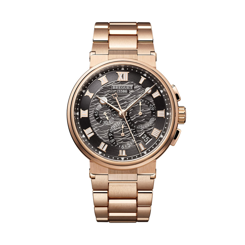 The Breguet Marine Chronographe 5527 is a rose gold analog wristwatch with a black textured dial, Roman numeral markers, chronometer-rated movement, three subdials, and a metal link bracelet.
