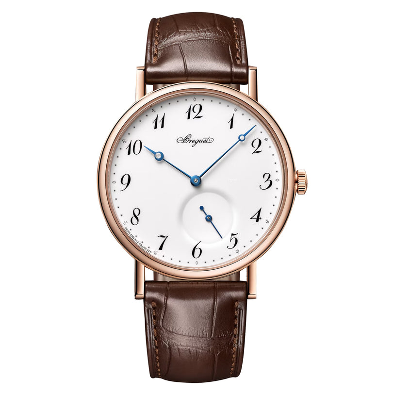 The Breguet Classique 7147 features a white grand feu enamel dial with black numerals, blue hands, brown leather strap, and a small seconds subdial at 6 o’clock—a refined tribute to Breguet’s timeless design.