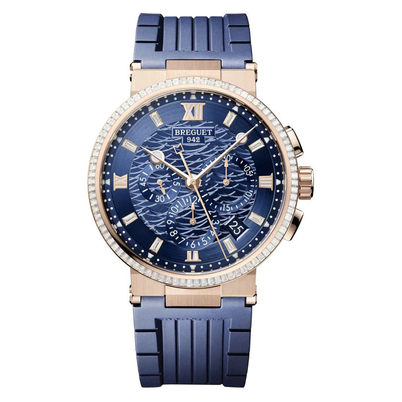 The Breguet Marine Chronographe 5529 is a luxury watch with a blue dial, gold case, blue strap, Roman numerals, three chronograph subdials, date display, and the Breguet name on the face.