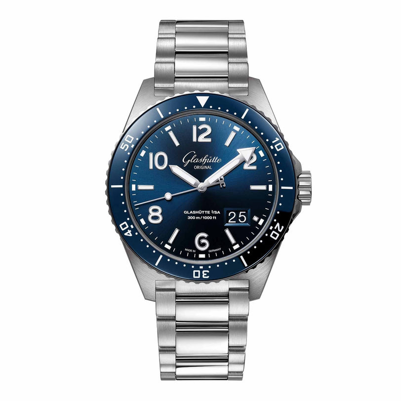 The Glashütte Original SeaQ Panorama Date is a unique stainless steel wristwatch with a blue dial, white markers, date display at 4 o’clock, and a metal bracelet.
