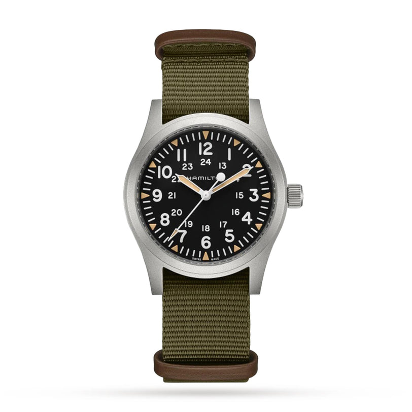 The Hamilton Khaki Field Mechanical 42mm wristwatch features a black dial, white numerals, silver case, and olive green fabric strap with a hand-wound H-50 movement, capturing the classic soldiers watch style. Shown against a white background.