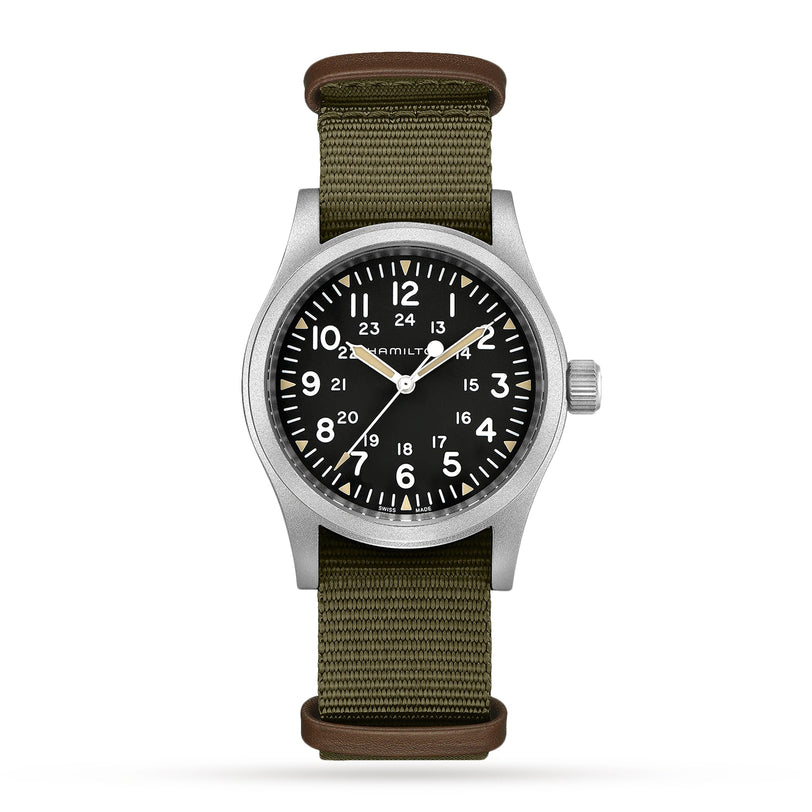 The Hamilton Khaki Field Mechanical 38mm features a black dial with white Arabic numerals, a stainless steel case, and an olive green NATO strap. It displays both 12-hour and 24-hour time for versatile utility.