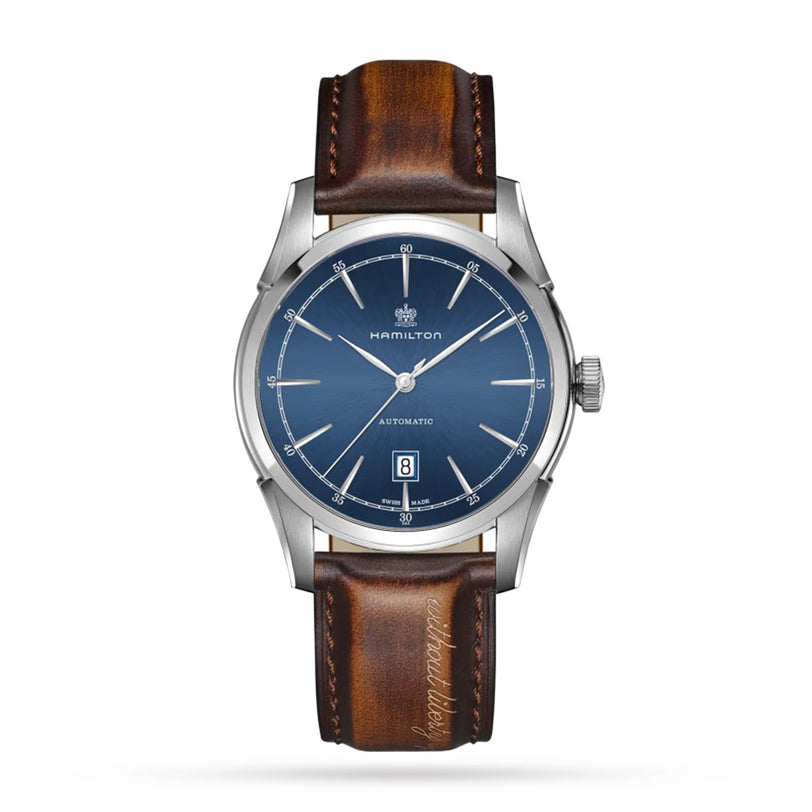 A Hamilton American Classic Spirit of Liberty Auto wristwatch with a silver case, blue dial, date at 6 o’clock, brown leather strap, and H-10 automatic movement with 80-hour power reserve, set on a white background.