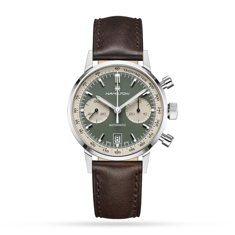 The Hamilton American Classic Intra-Matic Auto Chrono 40mm features a green dial, two subdials, vintage styling, a date window at 6 o’clock, and a brown leather strap on a white background.