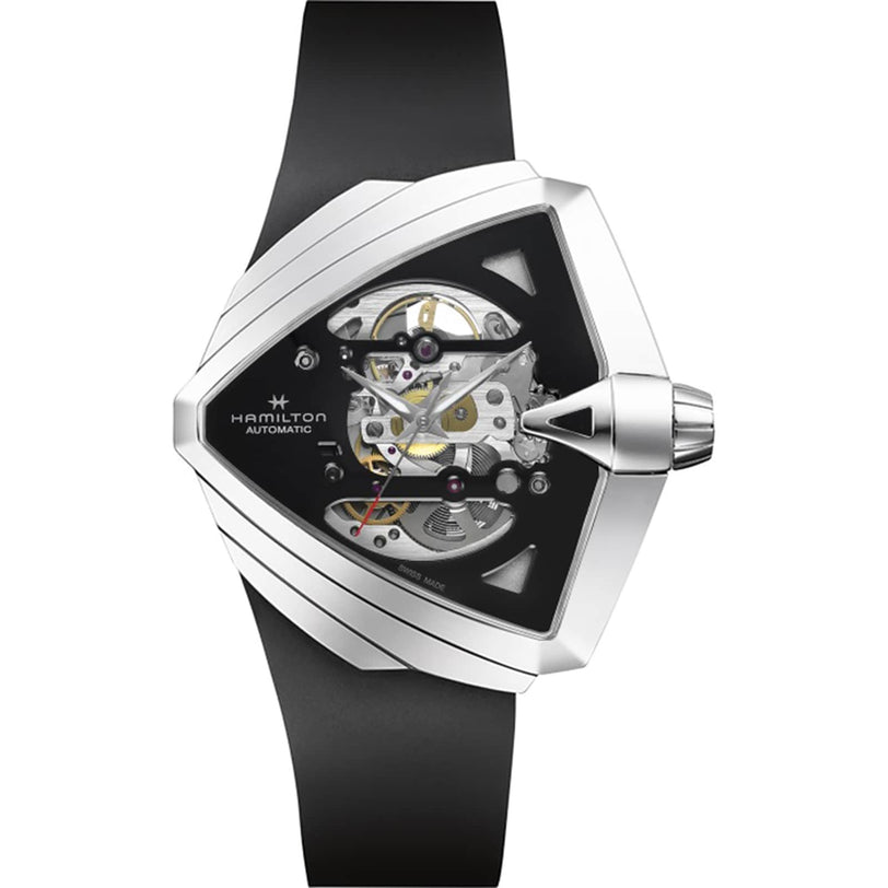 The Hamilton Ventura XXL Skeleton Auto showcases an oversized dial, triangular stainless steel case, distinctive skeleton cut-outs revealing the movement, and a sleek black strap.
