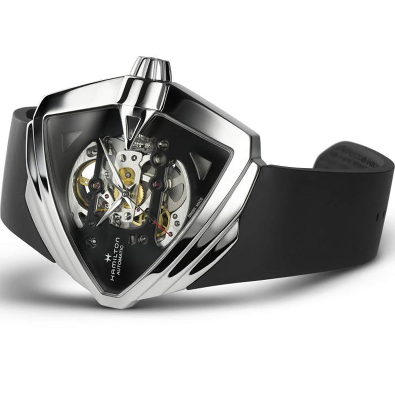 The Hamilton Ventura XXL Skeleton Auto wristwatch features a black strap, triangular case, and precision cut-outs that reveal its exposed mechanical movement on an extra-large dial.