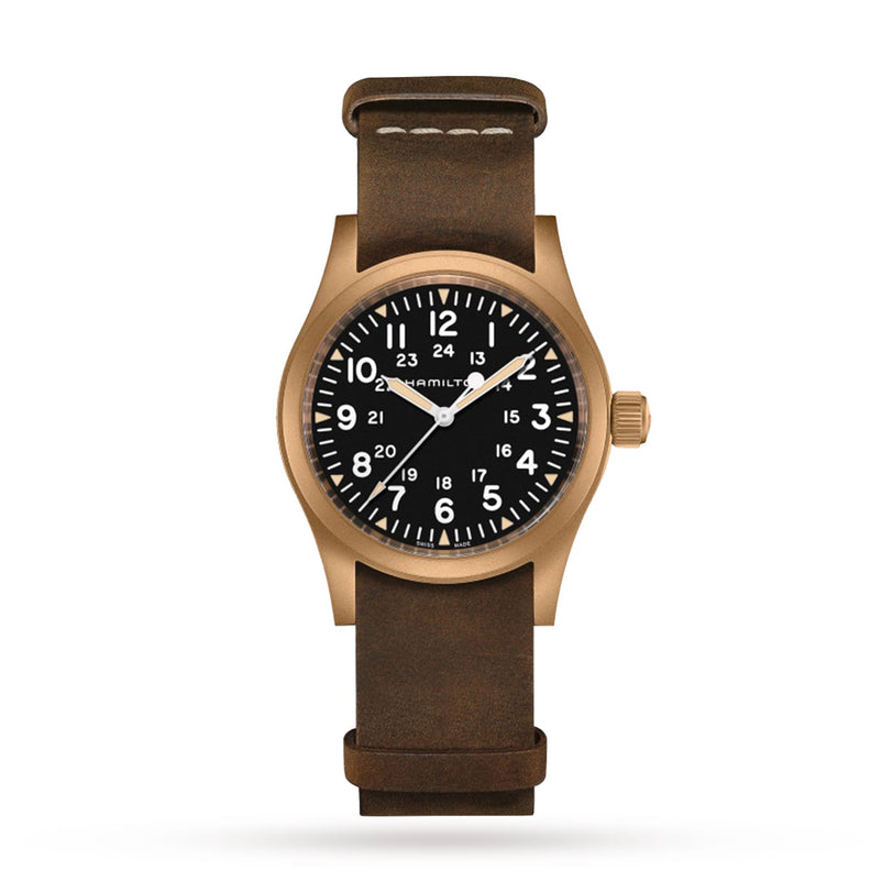 A Hamilton Khaki Field Mechanical watch features a black dial with white numerals and a brown leather strap, highlighting its military heritage against a white background.