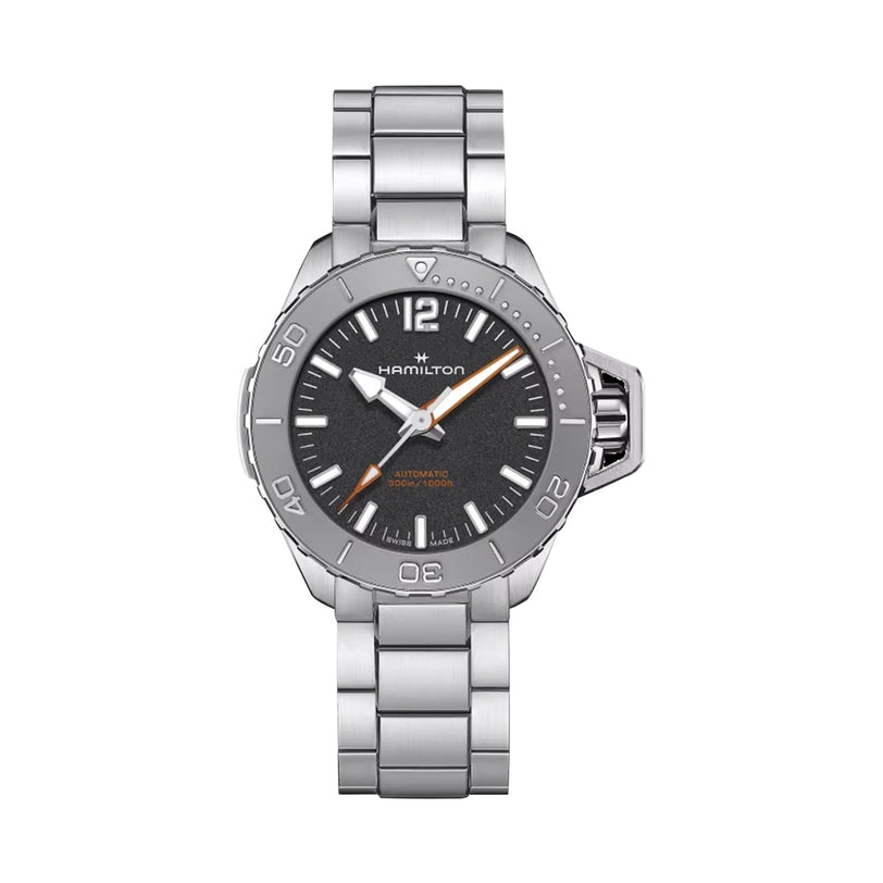 The Hamilton Khaki Navy Frogman Auto watch features a stainless steel case, black dial, silver hour markers, and metal bracelet. Displayed on a white background, it stands out for its impressive water resistance.