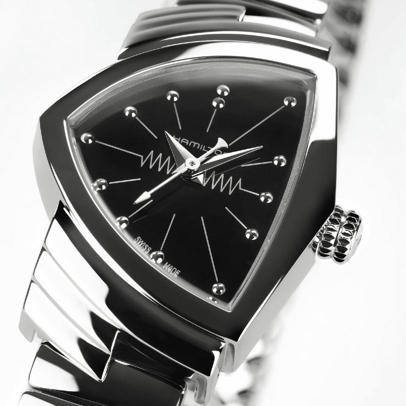Close-up of the Hamilton Ventura S Quartz, featuring a silver case, black triangular dial, dot hour markers, and central zigzag line detail—an iconic example of Mid-Century Modern design.