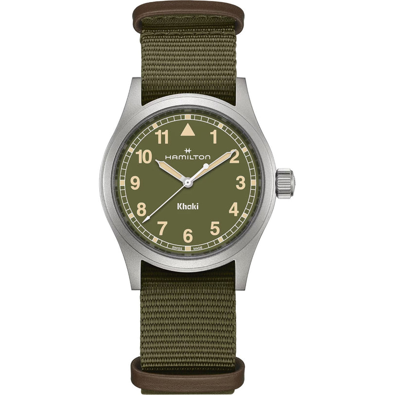 The Hamilton Khaki Field Quartz 38mm features an olive green dial with tan numerals and a green fabric strap.