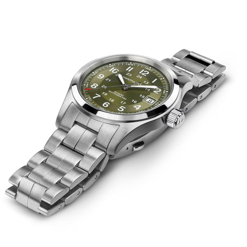 The Hamilton Khaki Field Auto 38mm is a stainless steel wristwatch featuring a green dial with white numerals and a metal link bracelet.