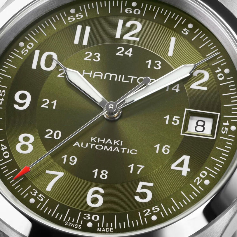 Close-up of the Hamilton Khaki Field Auto 38mm watch in green, displaying the time as 8:21:36 and featuring a date window at 3 oclock.