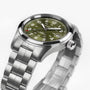 The Hamilton Khaki Field Auto 38mm features a stainless steel case, olive green dial with white numerals, and a metal link band.