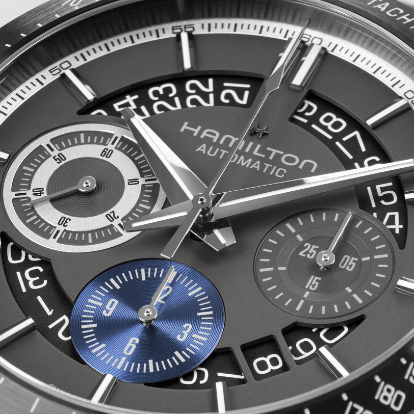 Close-up of the Hamilton Jazzmaster Performer Autochrono 42mm, featuring multiple dials, clear numerals, silver hands, and a blue subdial at 6 oclock with prominent chronograph counters.