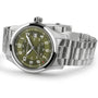 The Hamilton Khaki Field Auto 42mm features a stainless steel case, olive green dial with silver hour markers, H-10 automatic movement, date at 3 oclock, and metal link bracelet. Photographed on a white background. Military-inspired design.