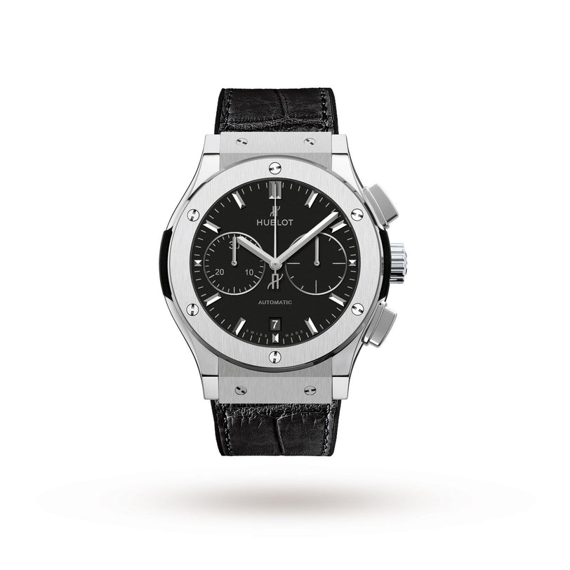 The Hublot Classic Fusion Chronograph Titanium wristwatch features a black dial with three subdials, date display, silver hour markers, self-winding movement, titanium case, and a black leather strap, shown against a white background.
