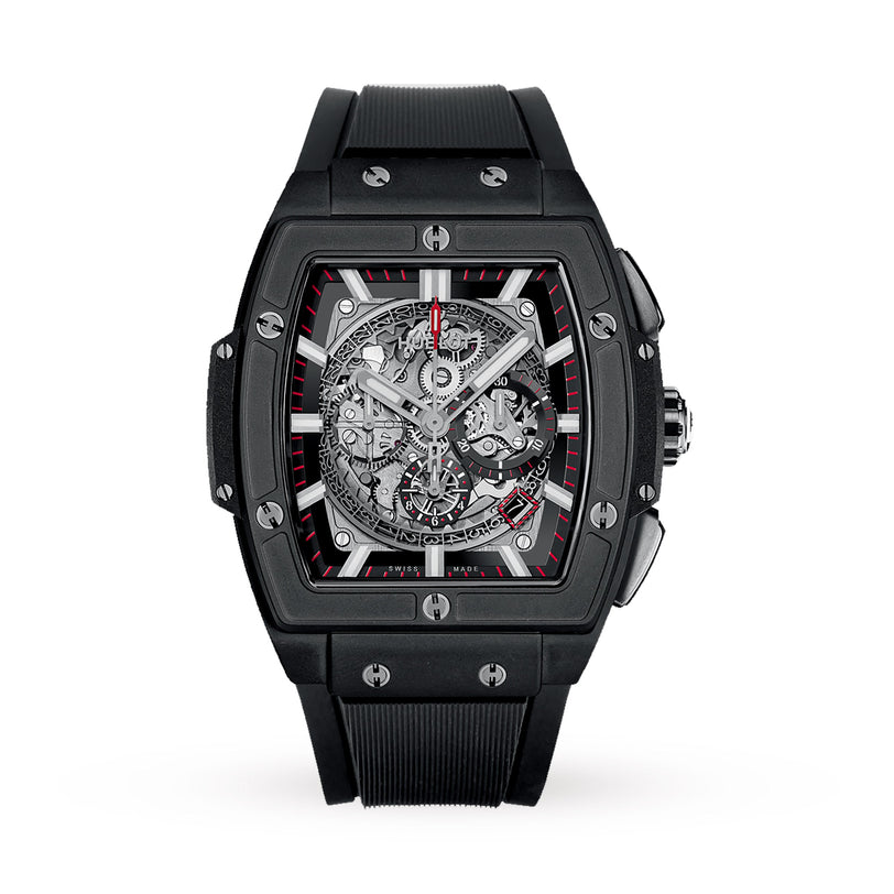 The Hublot Spirit of Big Bang Chronograph Black Magic is a black, rectangular luxury watch with a skeleton dial, red accents, visible gears, metallic bezel screws, black ceramic case, and black rubber strap.