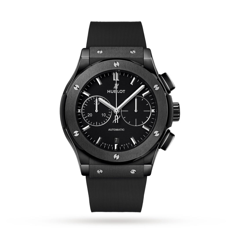 The Hublot Classic Fusion Chronograph Black Magic features a black ceramic case, black rubber strap, black dial with three subdials, date window at 6 o’clock, and silver hour markers.