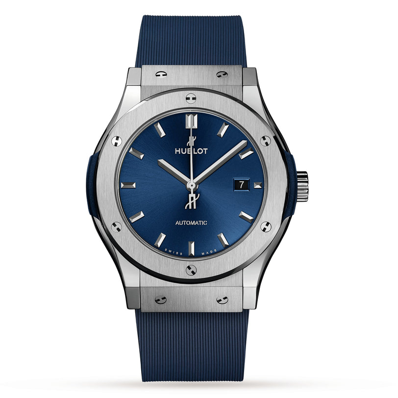The Hublot Classic Fusion Titanium Blue wristwatch features a titanium case, blue sunray dial, silver markers, date at 3 o’clock, and a blue strap, shown against a white background.