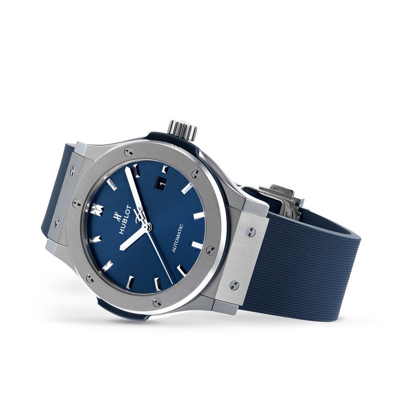 A Hublot Classic Fusion Titanium Blue wristwatch with a blue dial and blue rubber strap, displayed at an angle.