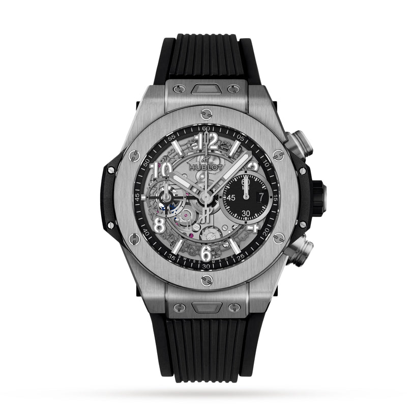 The Hublot Big Bang Unico Titanium is a silver and black chronograph wristwatch with a skeleton dial, black rubber strap, visible gears, and three subdials, featuring the iconic UNICO manufacture flyback movement. Shown on a white background.