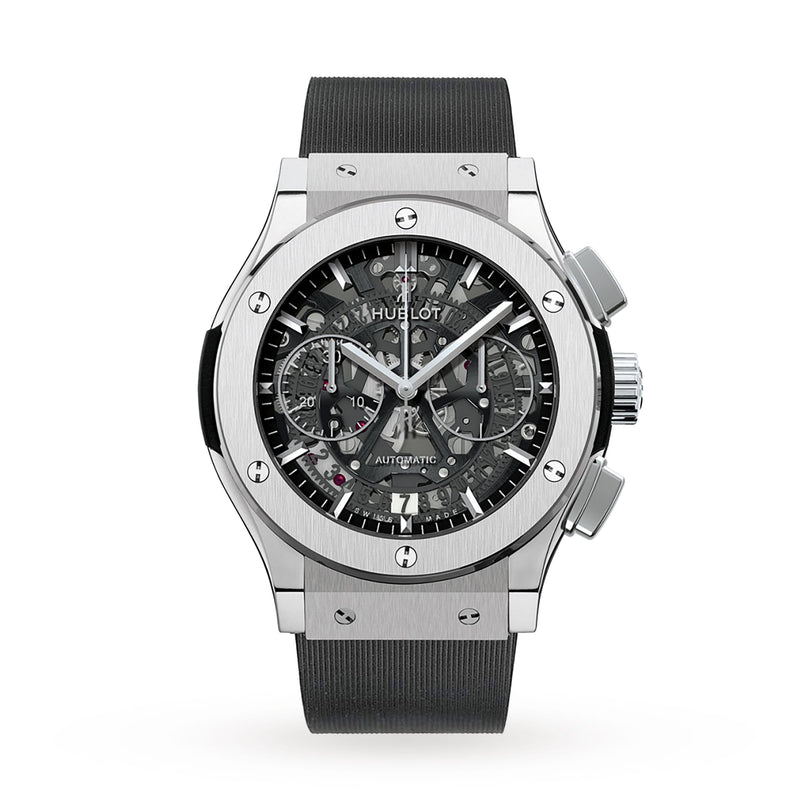 The Hublot Classic Fusion Aerofusion Titanium is a silver wristwatch with a titanium case, black strap, skeleton dial, chronograph subdials, and visible screws on the bezel.