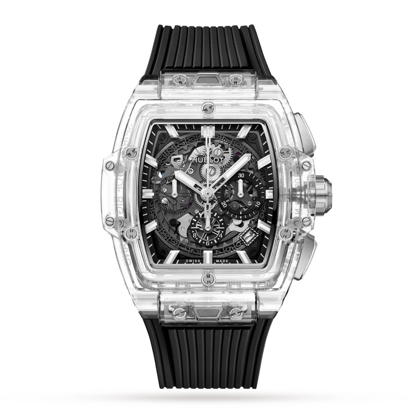 The Hublot Spirit Of Big Bang Magic Sapphire is a transparent rectangular watch with a sapphire crystal case, visible mechanical movement, black accents, and a black ribbed rubber strap.