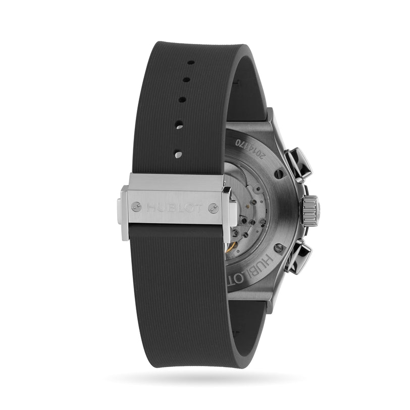 Back view of the Hublot Classic Fusion Racing Grey Chronograph Titanium, featuring a black rubber strap, titanium case, stainless steel clasp, and a visible mechanical movement through its transparent case back.