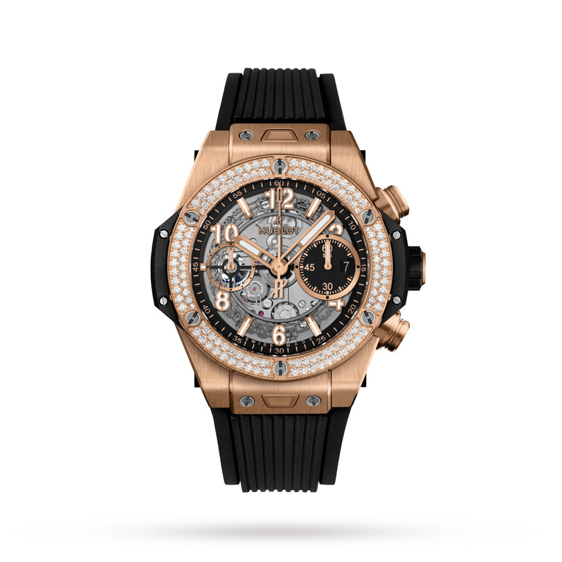 The Hublot Big Bang Unico King Diamonds watch features gold, diamond accents, a black rubber strap, visible Unico 2 gears, and multiple subdials on a white background.
