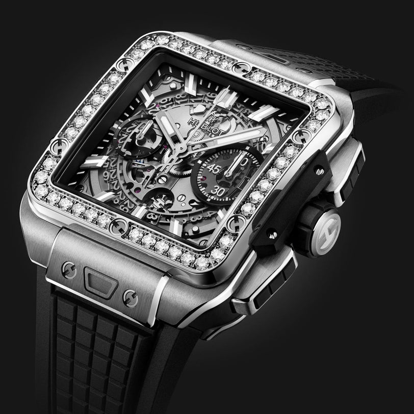Hublot Square Bang Unico Titanium Diamonds luxury watch featuring a skeleton dial, HUB1280 UNICO movement, diamond-set bezel, titanium case, chronograph subdials, and black rubber strap against a dark background.