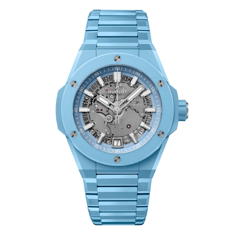 The Hublot Big Bang Integrated Time Only Sky Blue Ceramic features a skeleton dial with exposed gears and a matching blue ceramic bracelet.
