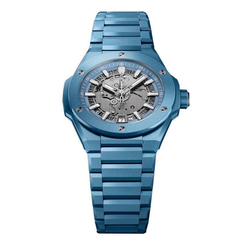The Hublot Big Bang Integrated Time Only Sky Blue Ceramic is a blue ceramic wristwatch with a skeleton dial, visible gears, and silver hour markers and hands.