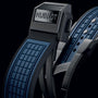 Close-up of a Hublot Square Bang Unico Blue Ceramic watch strap featuring a black and blue textured rubber design and a metallic clasp engraved with the Hublot logo.