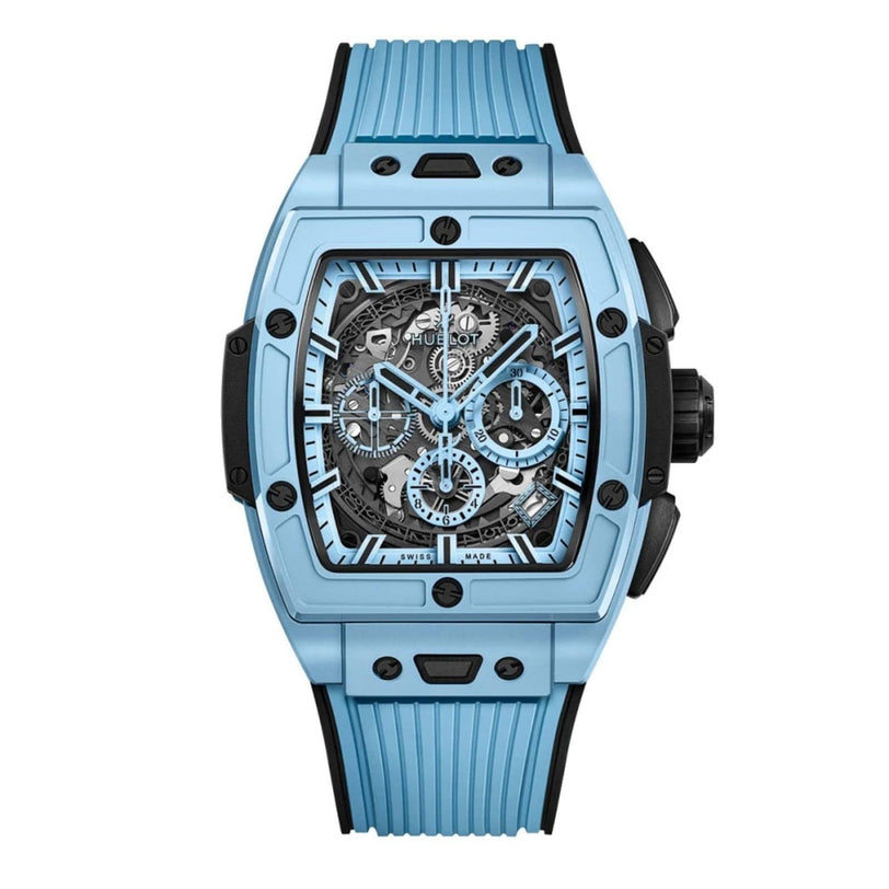 The Hublot Spirit of Big Bang Sky Blue Ceramic is a rectangular blue wristwatch with a skeleton dial, black accents, multiple subdials, a ribbed blue strap, exposed movement, and the precision HUB4700 caliber.