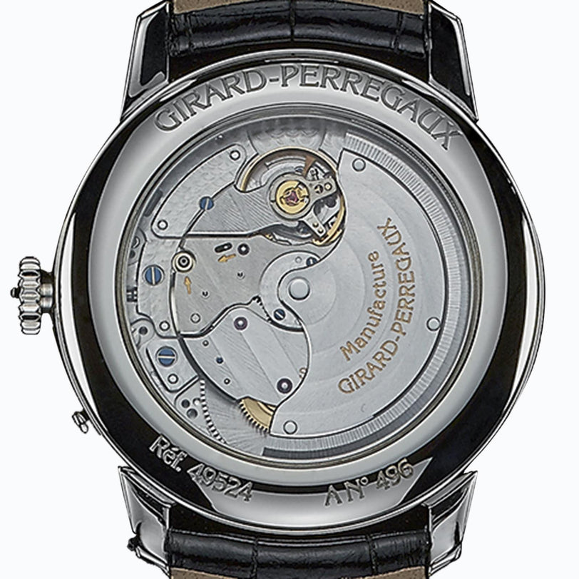 Back view of the Girard-Perregaux 1966 Moon Phases wristwatch, highlighting its exposed mechanical movement and inner workings through a transparent case back.