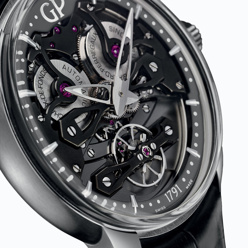 Close-up of the Girard-Perregaux Neo Bridges watch, showcasing its skeleton design with black bridges, visible gears, purple jewels, automatic movement, and a sleek black leather strap.