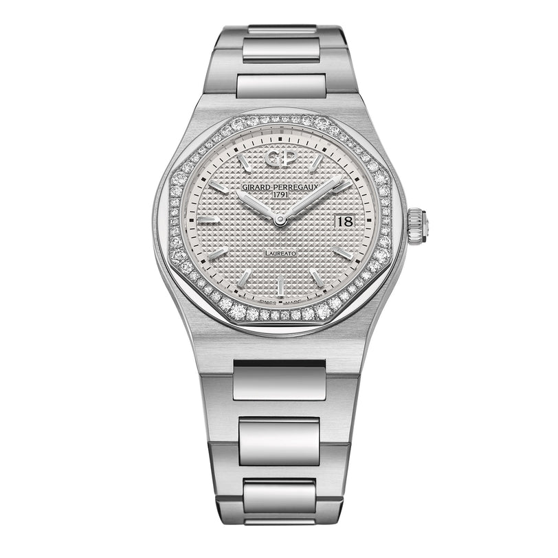 The Girard-Perregaux Laureato 34 is a silver wristwatch with a round, diamond-studded octagonal bezel, textured dial, date display at 3 o’clock, and a metal bracelet.