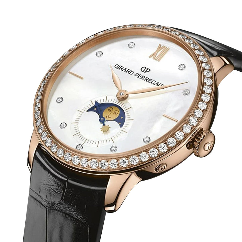 The Girard-Perregaux 1966 Moon Phases features a diamond bezel, mother-of-pearl dial with moon phase display, Roman numeral marker, and a black leather strap—an elegant piece inspired by the iconic 1966 collection.