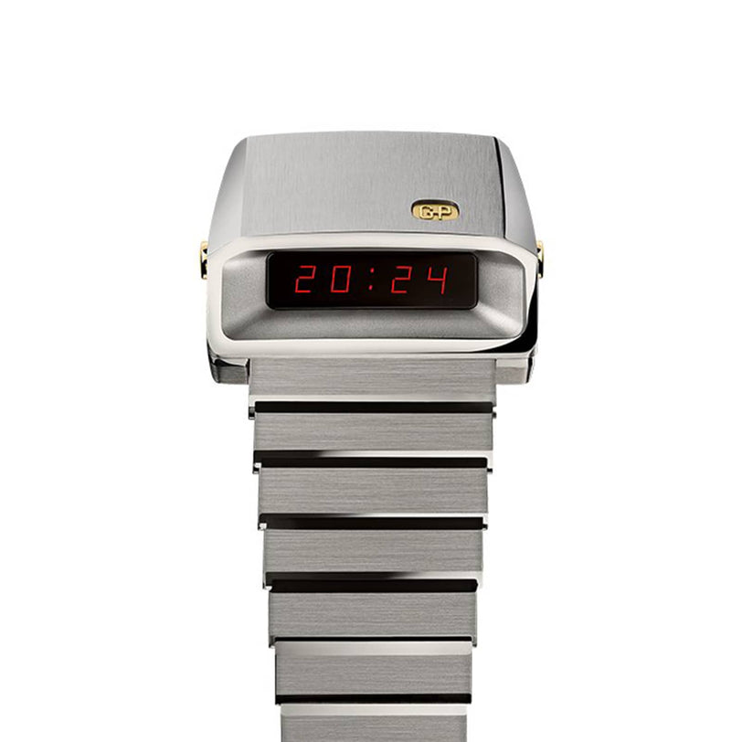 The Girard-Perregaux Casquette 2.0 Titanium & Gold is a digital wristwatch with a brushed titanium band and case, showing the time 20:24 in red LED numbers.
