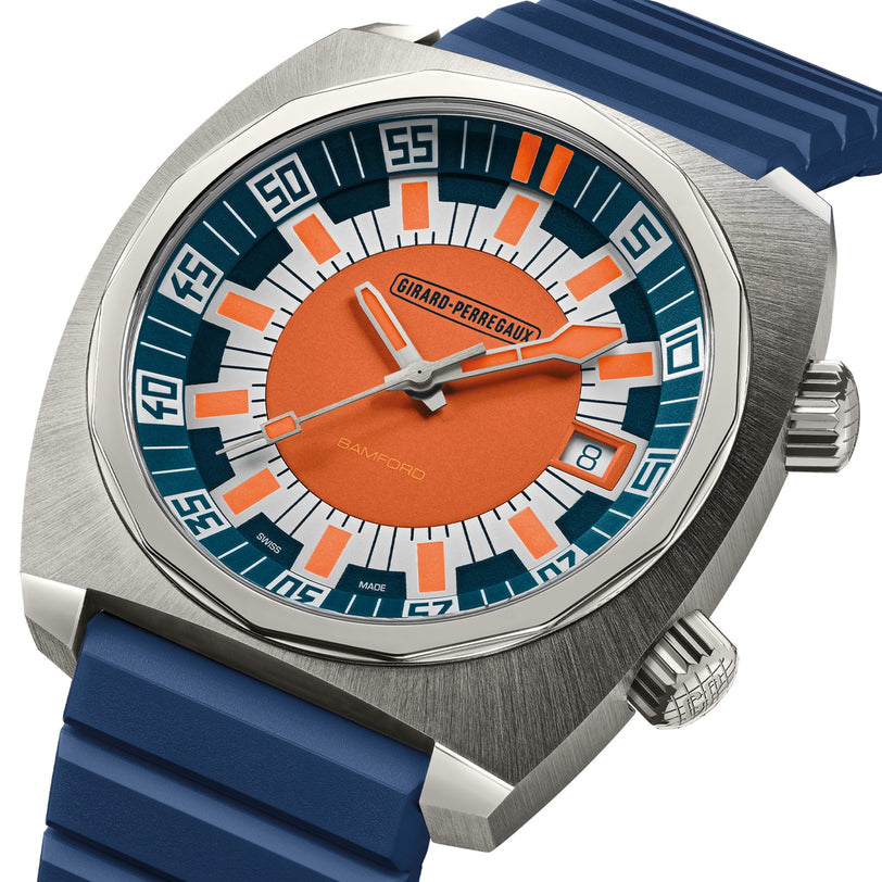The Girard-Perregaux Deep Diver features an orange and blue dial paired with a blue rubber strap.