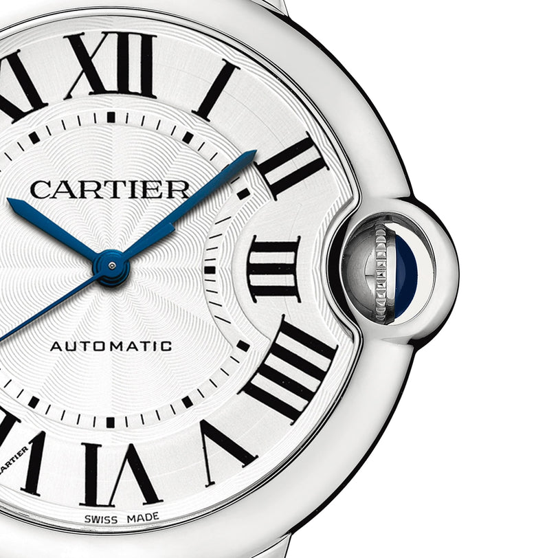 Close-up of the Cartier Ballon Bleu de Cartier watch, showcasing Roman numerals, blue hands, and a blue sapphire cabochon crown on the right, powered by a self-winding mechanical movement.