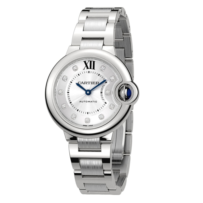 The Cartier Ballon Bleu de Cartier wristwatch features a round silver face, Roman numeral XII, diamond hour markers, blue hands, a sapphire cabochon crown, and a metal bracelet.