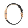 Side view of the Cartier Santos-Dumont, showcasing its 18K rose gold case, blue cabochon crown, and black leather strap with matching rose gold buckle.