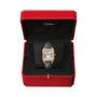 A Cartier Santos-Dumont watch with a black leather strap and 18K rose gold rectangular case is displayed in an open red box with a black velvet interior.
