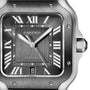 Close-up of a Cartier Santos de Cartier watch featuring a square face, Roman numeral markers, date display at 6 o’clock, silver hands on brushed metal, and an interchangeable bracelet.