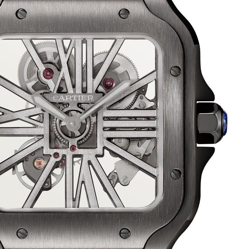 Close-up of the Cartier Santos de Cartier Skeleton watch face highlights its mechanical movement, visible gears, and brushed metal frame.